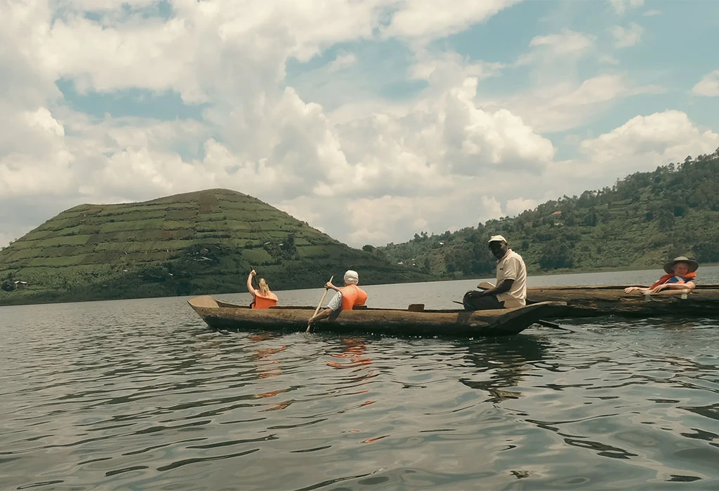 Canoeing On Lake Mutanda In A Traditional Dugout Canoe